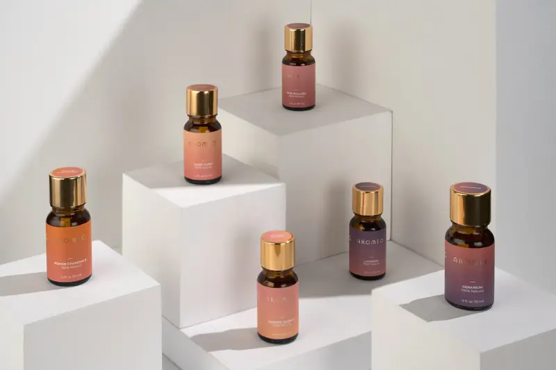 Essential oil bottles on white blocks