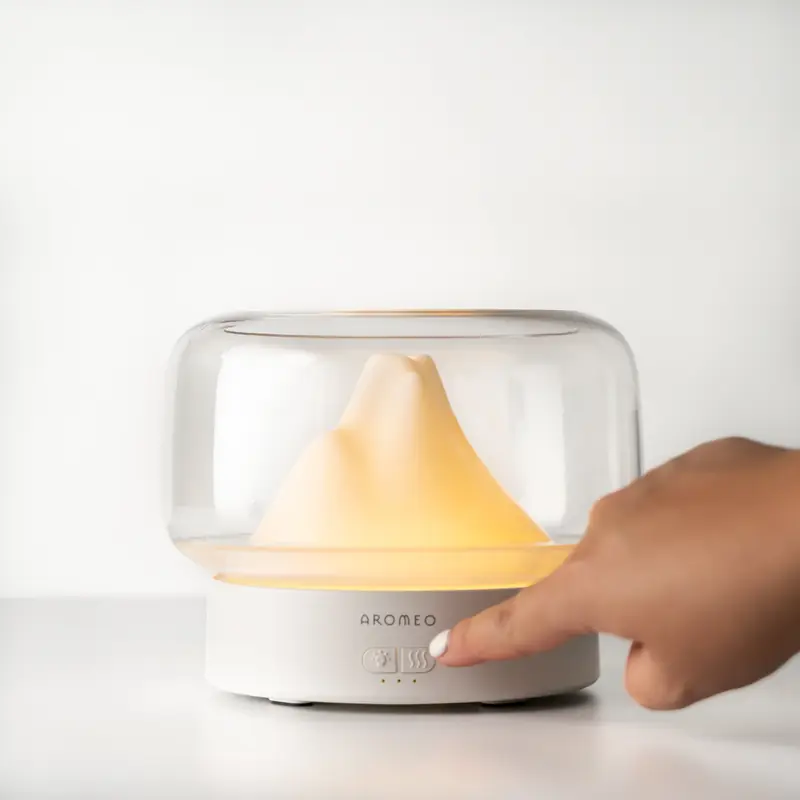 Aromeo diffuser glowing on a table
