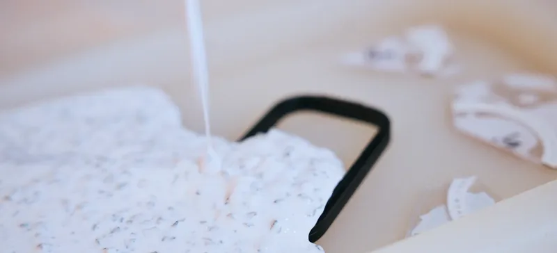 Phone-case frame resting on a speckled recycled-material sample