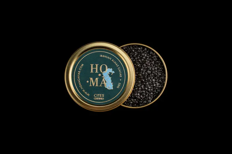 Homa caviar tin on a black background