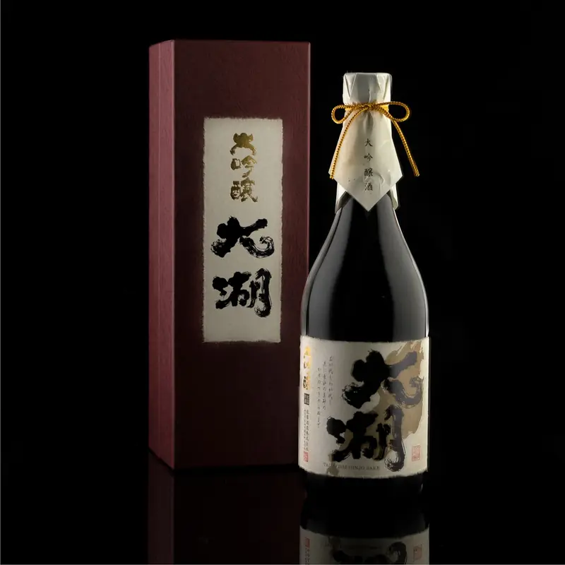 Sake bottle beside its gift box