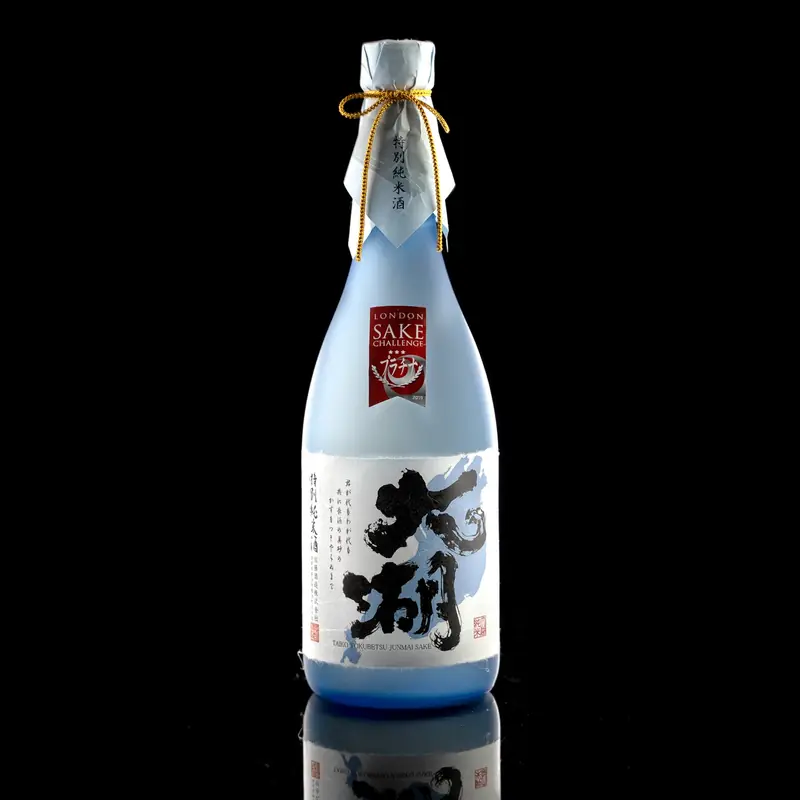 Blue sake bottle against black