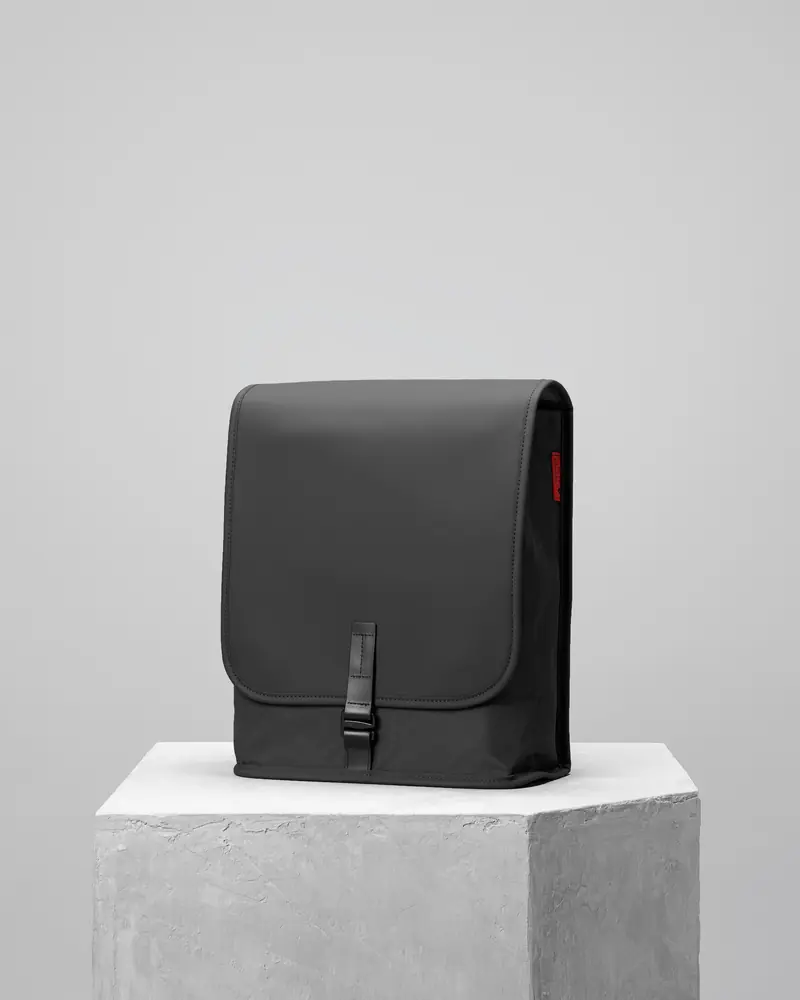 Black bag on a concrete plinth
